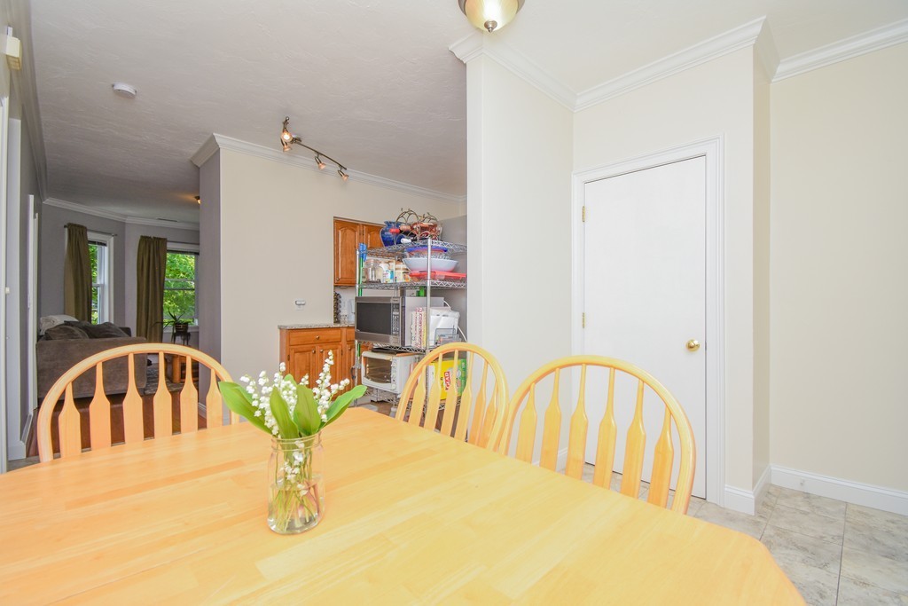 25 Wellington Street, Unit 1 Waltham, MA 02451 - Photo 6 of 18 a view of a dining room with furniture