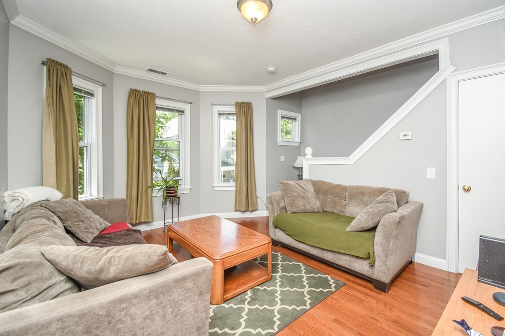 25 Wellington Street, Unit 1 Waltham, MA 02451 - Photo 9 of 18 a living room with furniture and a window