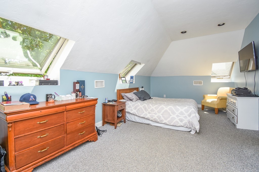 25 Wellington Street, Unit 1 Waltham, MA 02451 - Photo 10 of 18 a bedroom with a bed and window