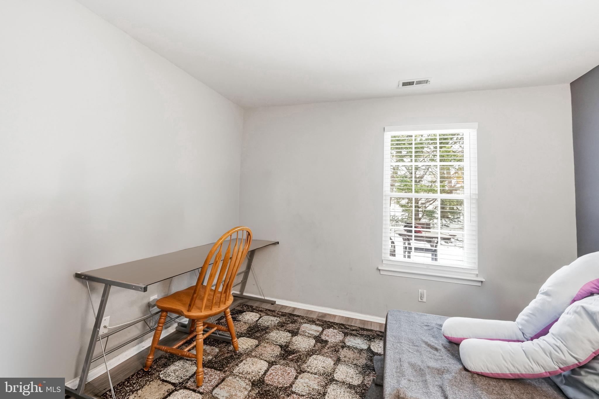 2705A Heatherstone Court Mount Laurel, NJ 08054 - Photo 20 of 29 a chair and table in a room