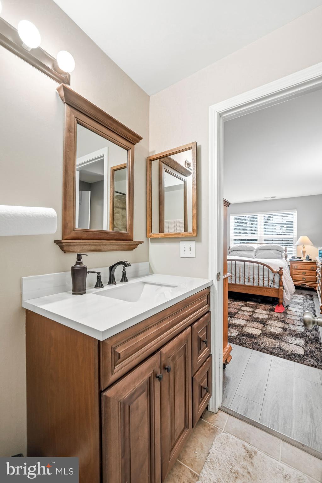 2705A Heatherstone Court Mount Laurel, NJ 08054 - Photo 23 of 29 a spacious bathroom with a sink and a mirror