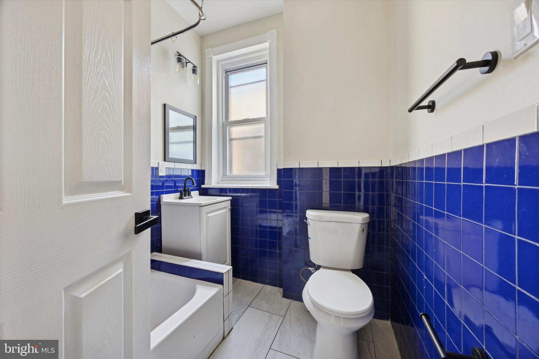 6002 West Thompson Street Philadelphia, PA 19151 - Photo 12 of 15 a bathroom with a toilet and a sink