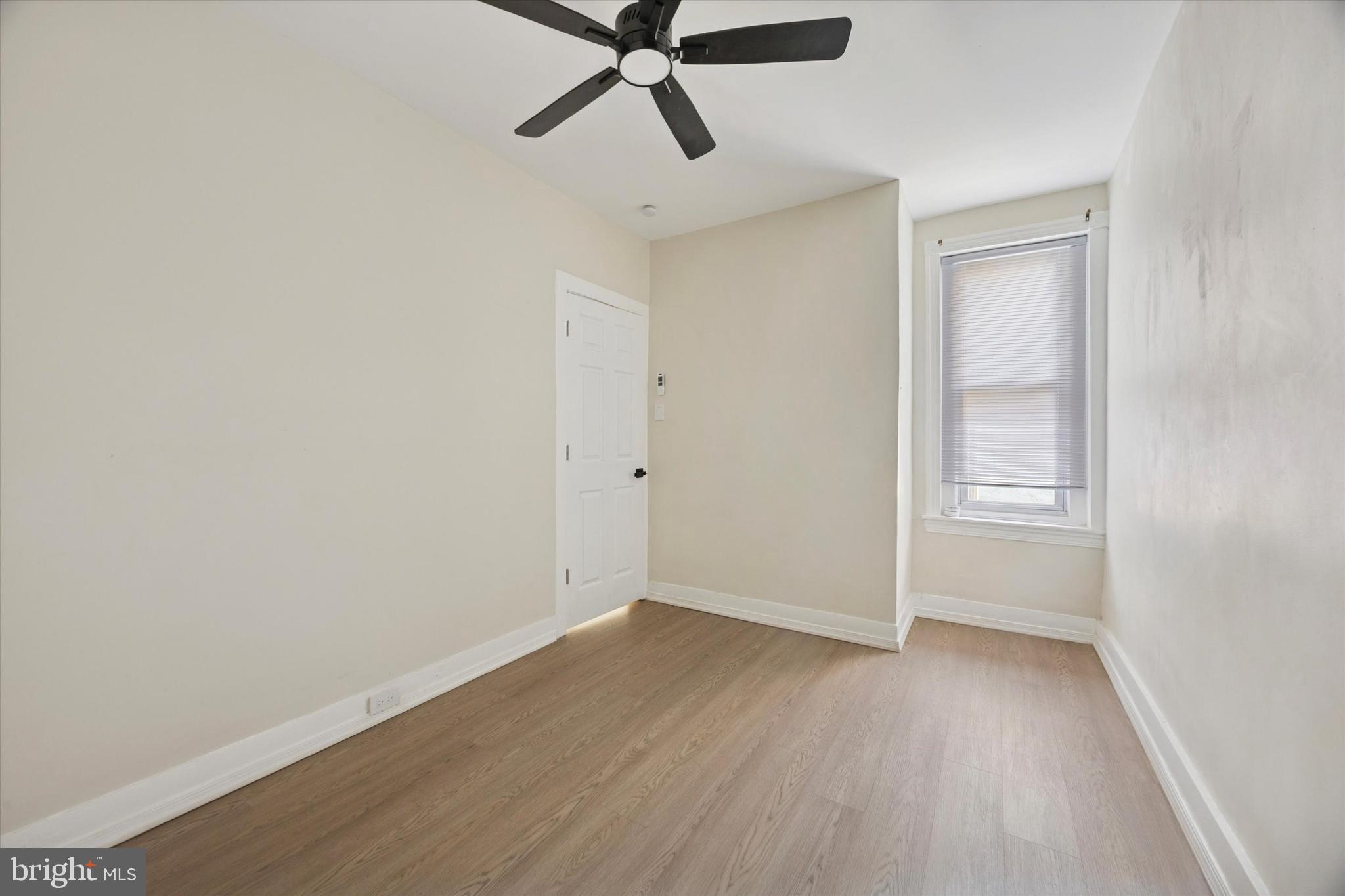 6002 West Thompson Street Philadelphia, PA 19151 - Photo 14 of 15 a view of a room with wooden floor and white walls