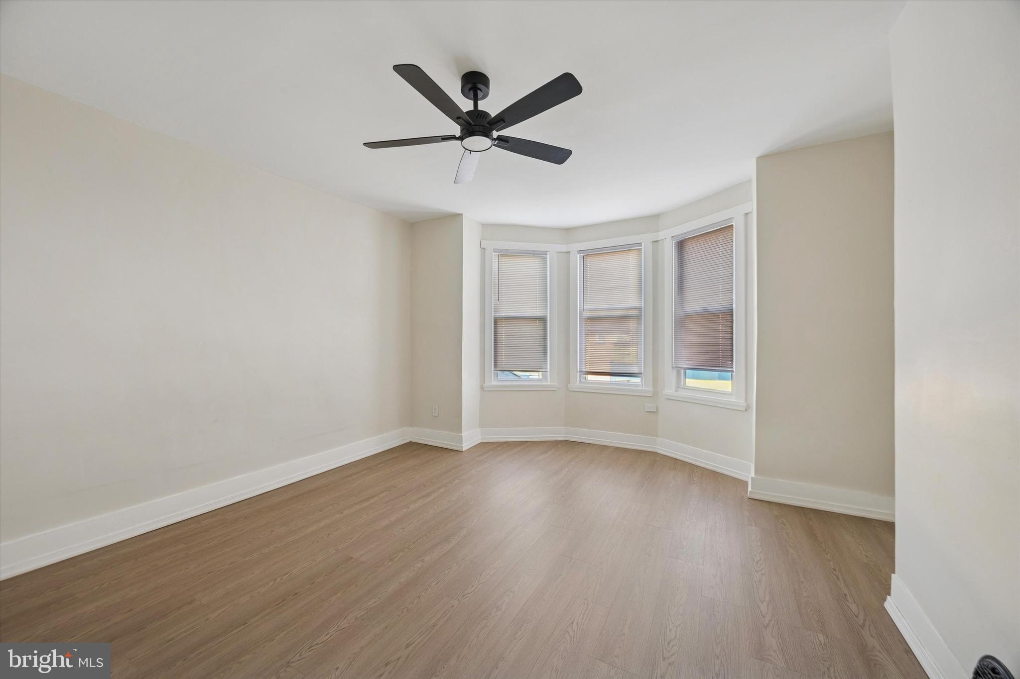 6002 West Thompson Street Philadelphia, PA 19151 - Photo 10 of 15 a view of a livingroom with a ceiling fan and wooden floor