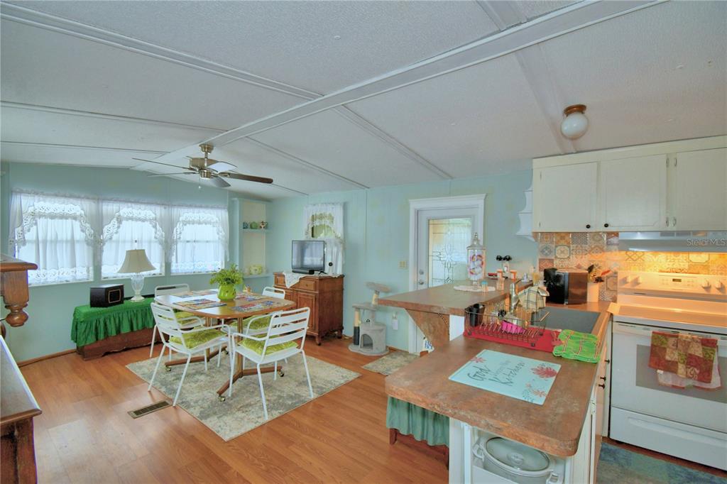 251 Patterson Road, Unit D35 Haines City, FL 33844 - Photo 14 of 37 a living room with furniture and a wooden floor
