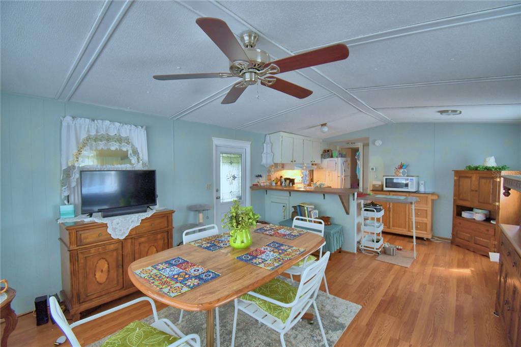 251 Patterson Road, Unit D35 Haines City, FL 33844 - Photo 18 of 37 a workspace with furniture and a wooden floor