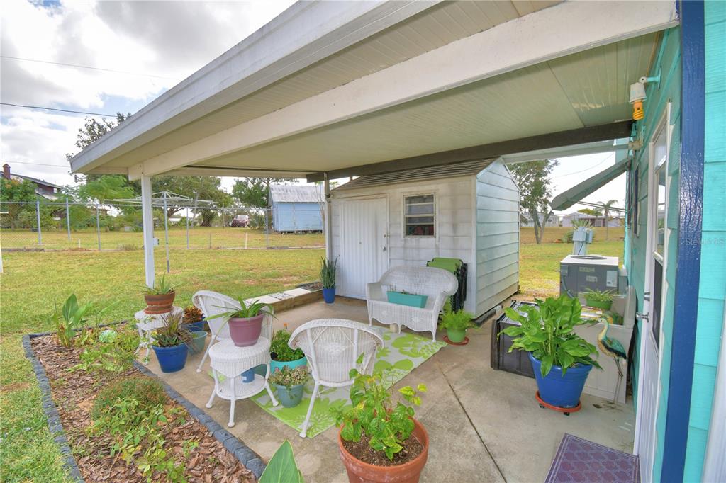 251 Patterson Road, Unit D35 Haines City, FL 33844 - Photo 20 of 37 a front view of a house with garden and patio