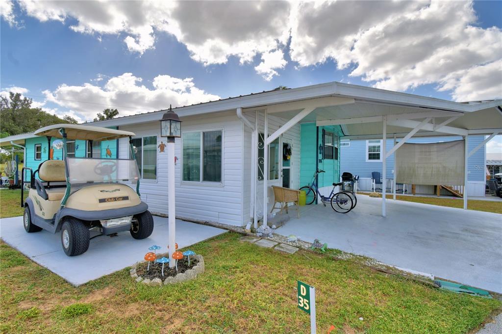 251 Patterson Road, Unit D35 Haines City, FL 33844 - Photo 2 of 37 a view of a chair and table in backyard of the house