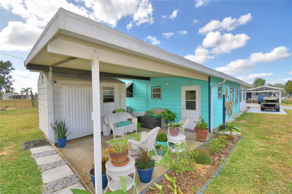 251 Patterson Road, Unit D35 Haines City, FL 33844 - Photo 21 of 37 a front view of a house with garden
