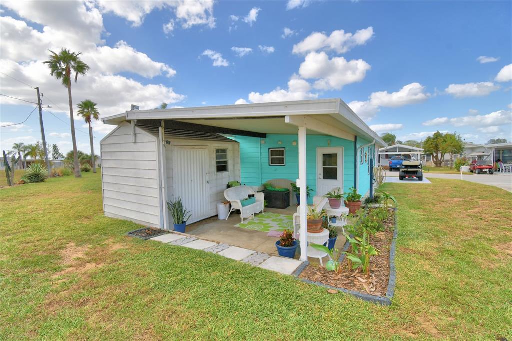 251 Patterson Road, Unit D35 Haines City, FL 33844 - Photo 23 of 37 a view of a house with backyard porch and sitting area