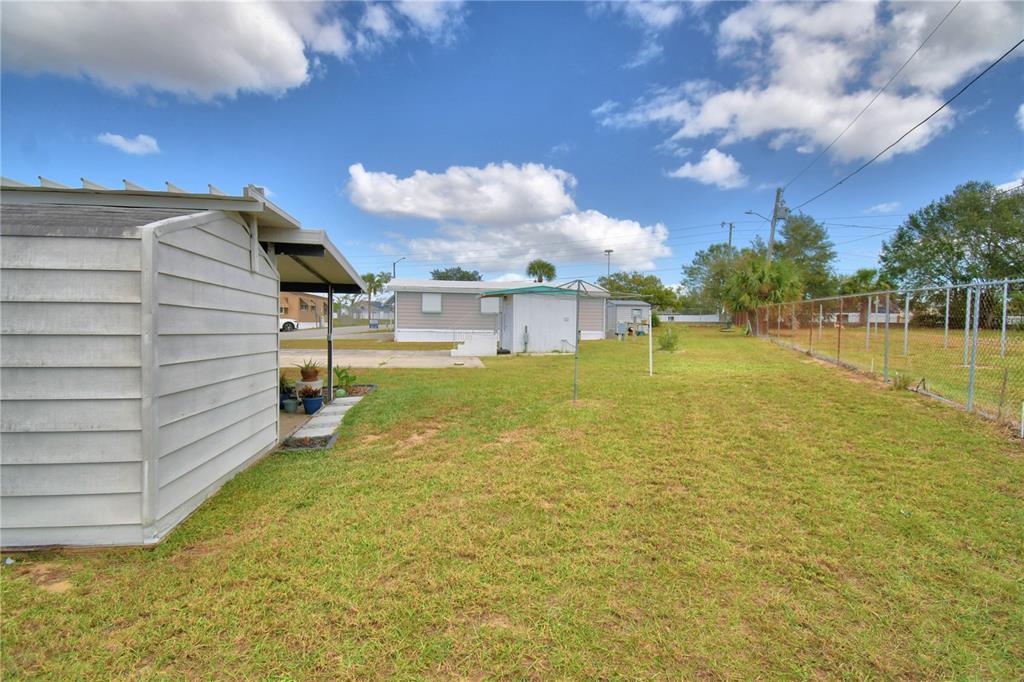 251 Patterson Road, Unit D35 Haines City, FL 33844 - Photo 26 of 37 a view of a lake with a building in the background