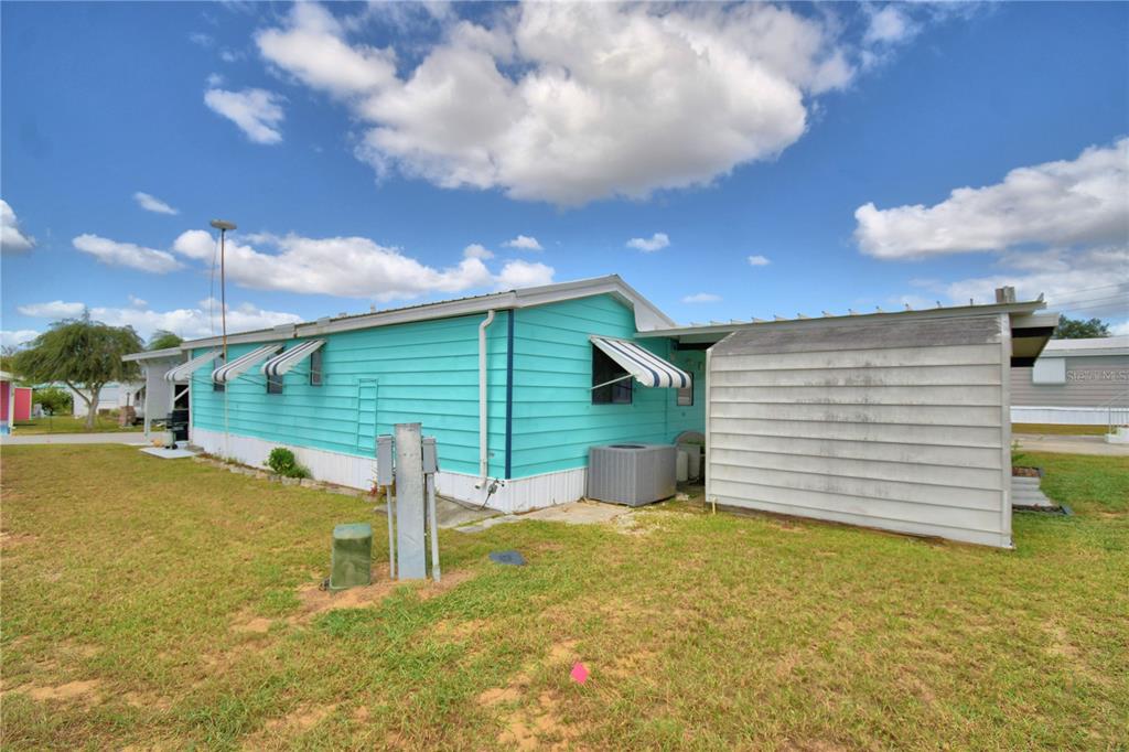 251 Patterson Road, Unit D35 Haines City, FL 33844 - Photo 27 of 37 a view of a backyard of the house