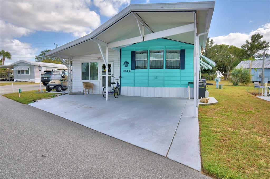 251 Patterson Road, Unit D35 Haines City, FL 33844 - Photo 3 of 37 a view of a house with backyard and porch