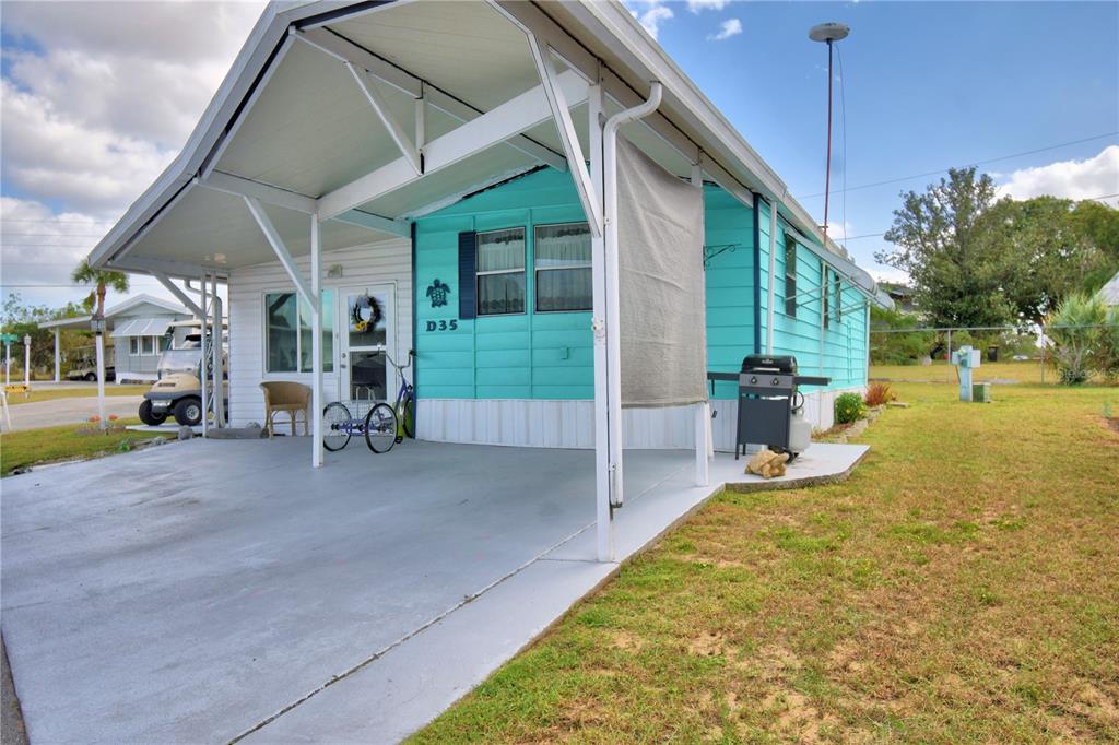 251 Patterson Road, Unit D35 Haines City, FL 33844 - Photo 4 of 37 a view of a house with a yard