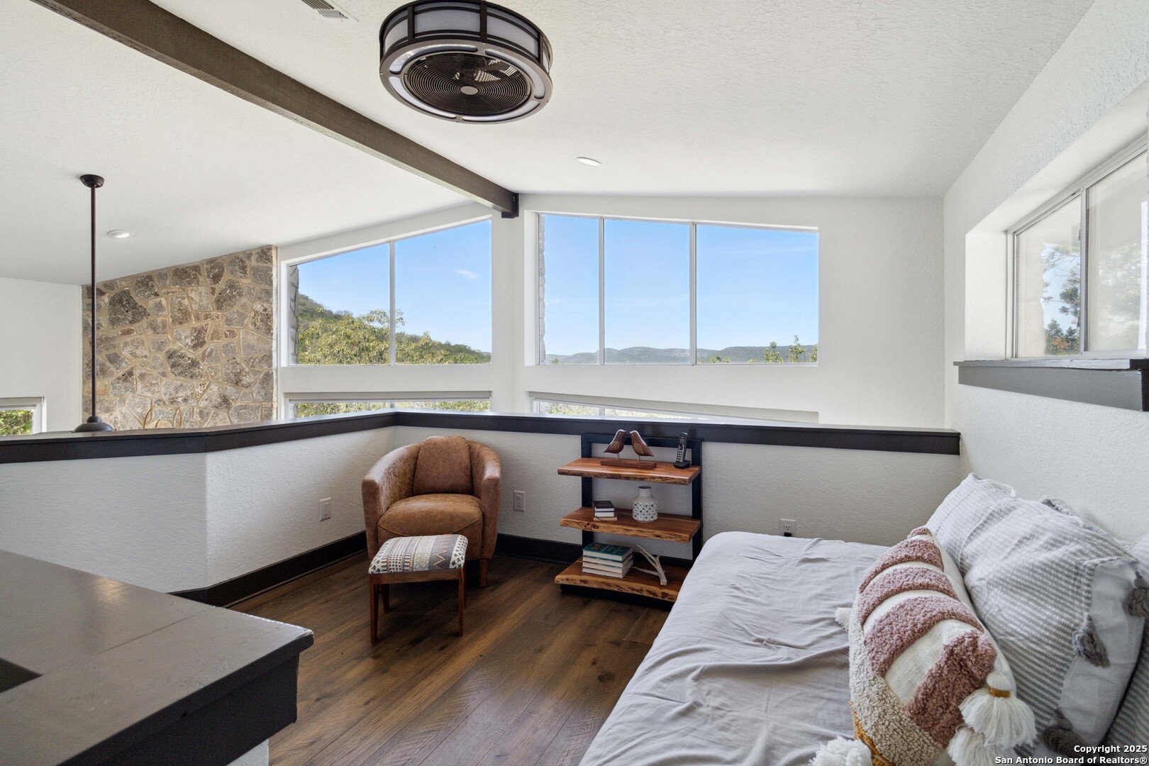 3293 North Little Creek Road Utopia, TX 78884 - Photo 17 of 65 a bedroom with bed and window