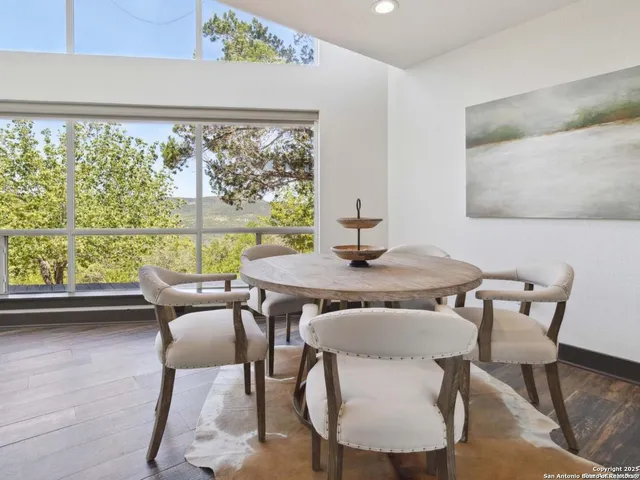 a view of a dining room with furniture window and outside view
