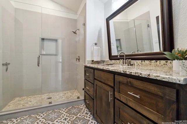 a dining room with furniture a rug and wooden floor