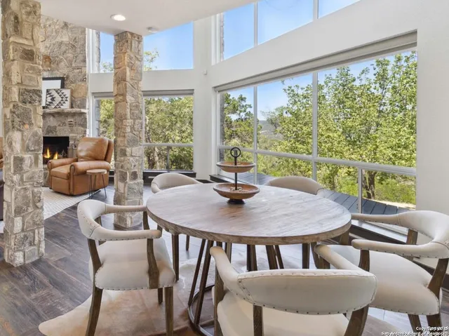 a view of a dining room with furniture window and outside view