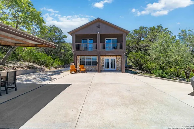 an aerial view of a house with yard swimming pool and outdoor seating