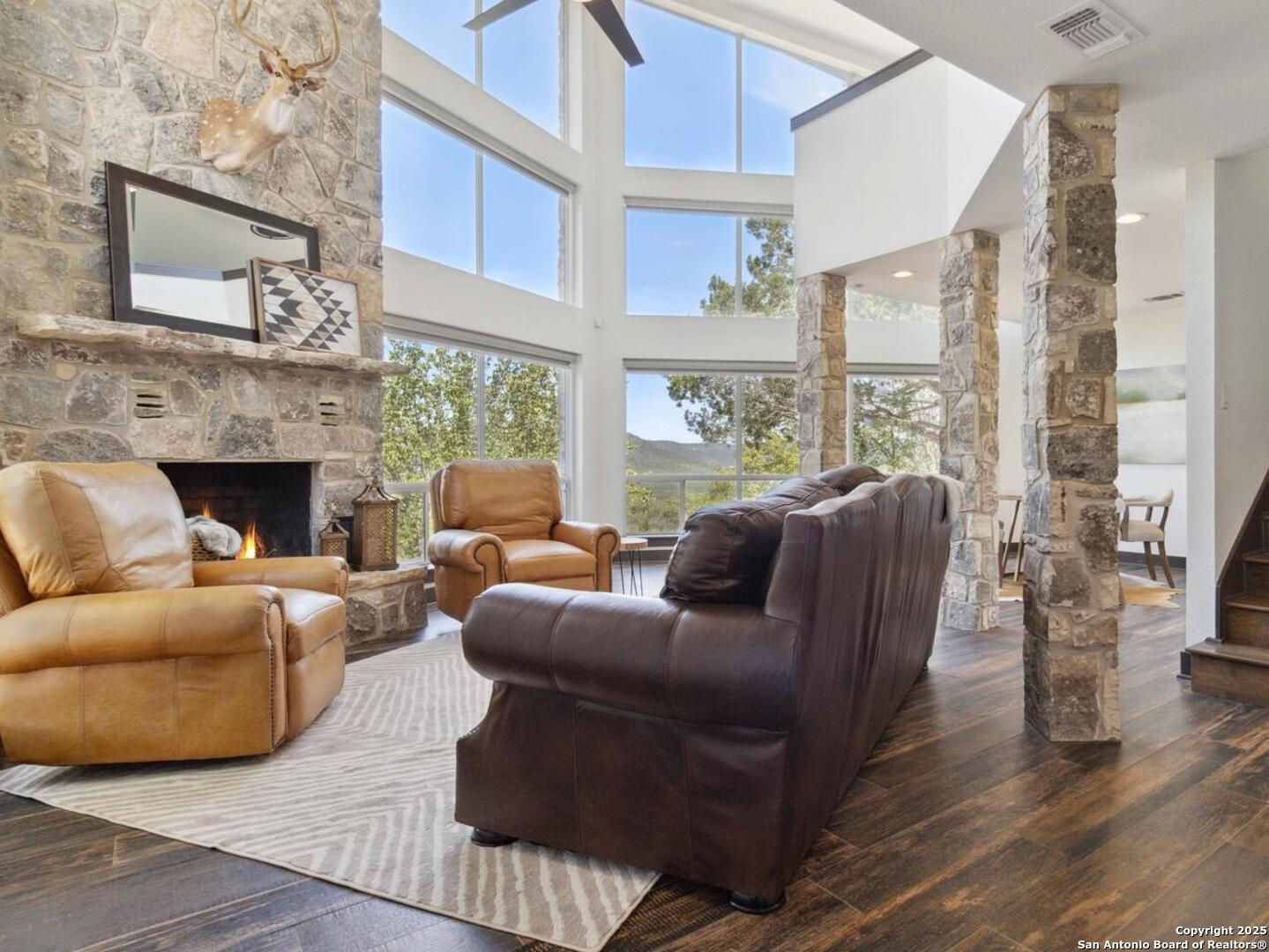 3293 North Little Creek Road Utopia, TX 78884 - Photo 4 of 65 a living room with furniture large window and fireplace