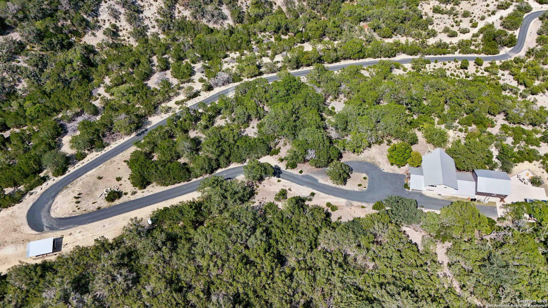 3293 North Little Creek Road Utopia, TX 78884 - Photo 44 of 65 an aerial view of a house with yard swimming pool and outdoor seating