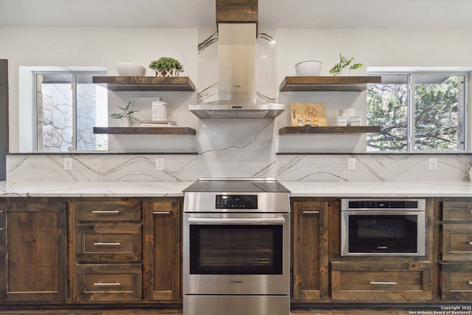3293 North Little Creek Road Utopia, TX 78884 - Photo 6 of 65 a kitchen with stainless steel appliances a stove and a cabinets