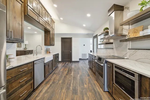 a kitchen with a sink cabinets and a window