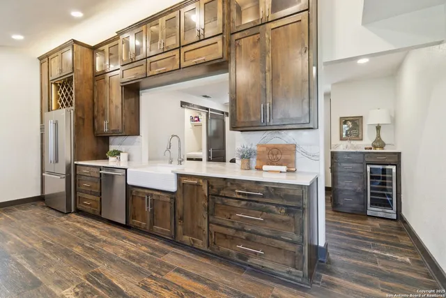 a spacious bathroom with a sink and a mirror