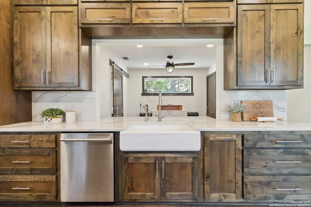 a bedroom with a bed a lamp and a large window