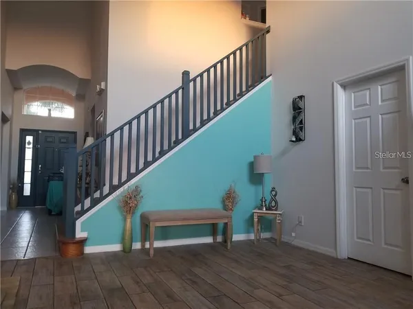 a view of entryway with wooden floor