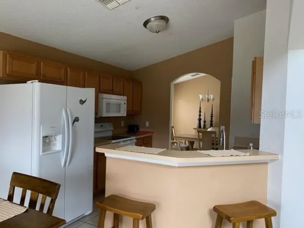 a bathroom with a sink a mirror and a shower