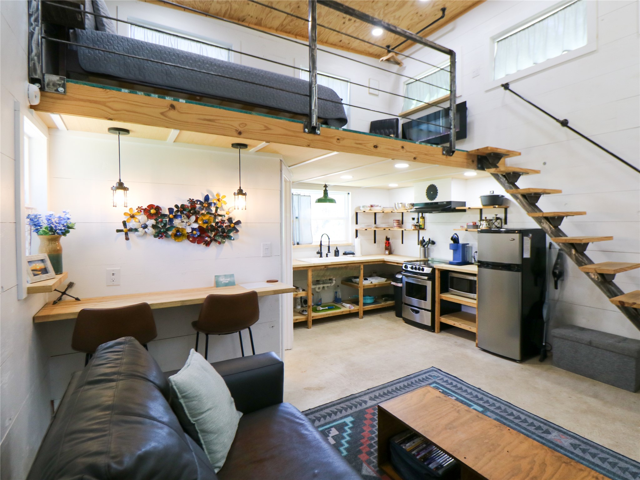 5200 Ranch To Market 1431 Marble Falls, TX 78654 - Photo 12 of 38 a living room with furniture and a chandelier
