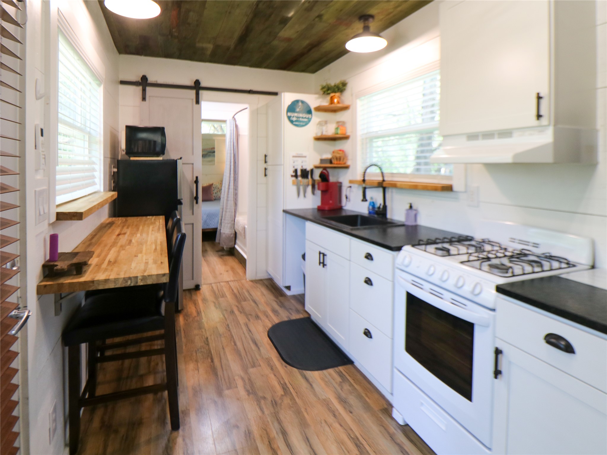 5200 Ranch To Market 1431 Marble Falls, TX 78654 - Photo 19 of 38 a kitchen with a stove and a wooden floors