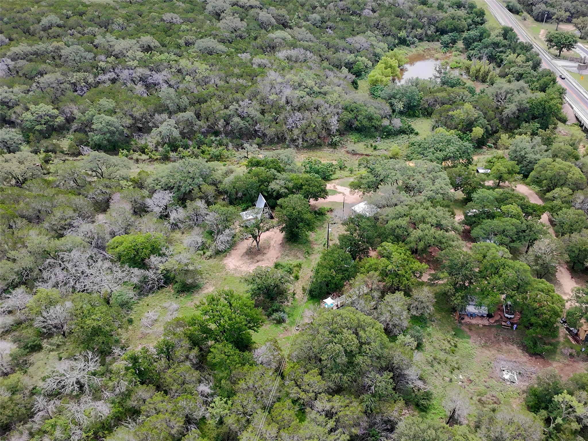 5200 Ranch To Market 1431 Marble Falls, TX 78654 - Photo 24 of 38 an aerial view of residential house with outdoor space and trees all around