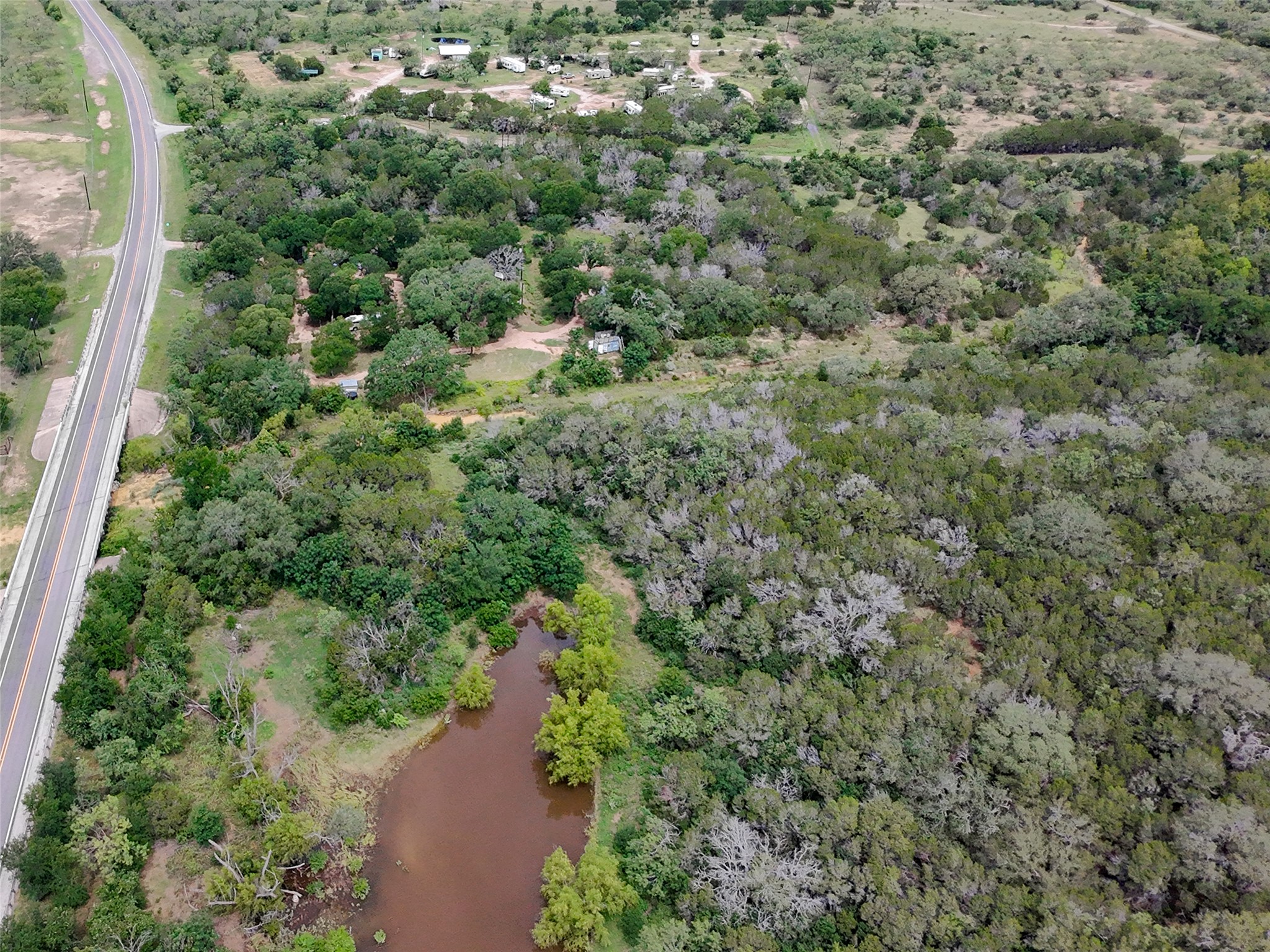 5200 Ranch To Market 1431 Marble Falls, TX 78654 - Photo 26 of 38 an aerial view of residential house with outdoor space and trees all around