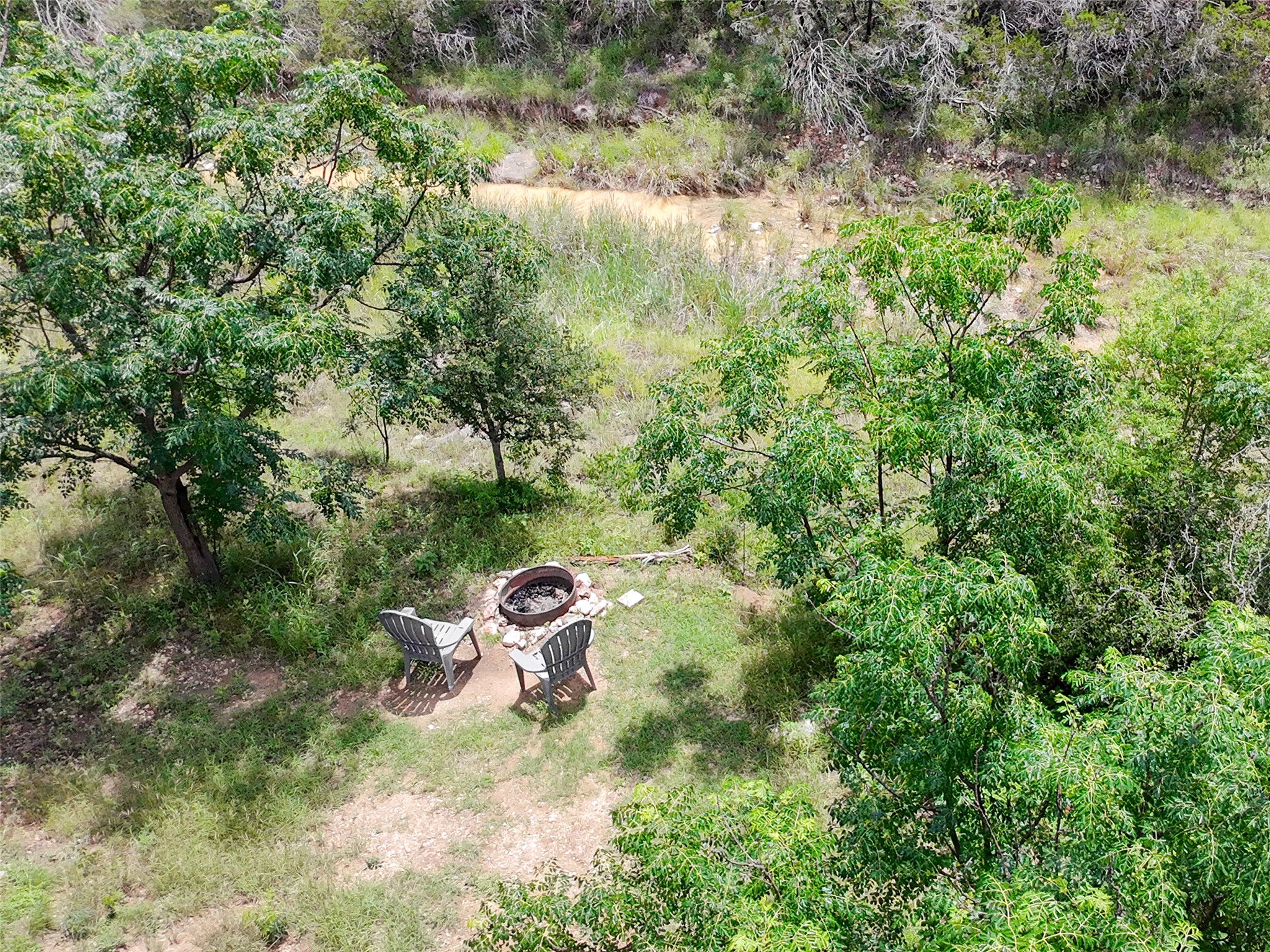 5200 Ranch To Market 1431 Marble Falls, TX 78654 - Photo 33 of 38 a backyard of a house with a yard and outdoor seating