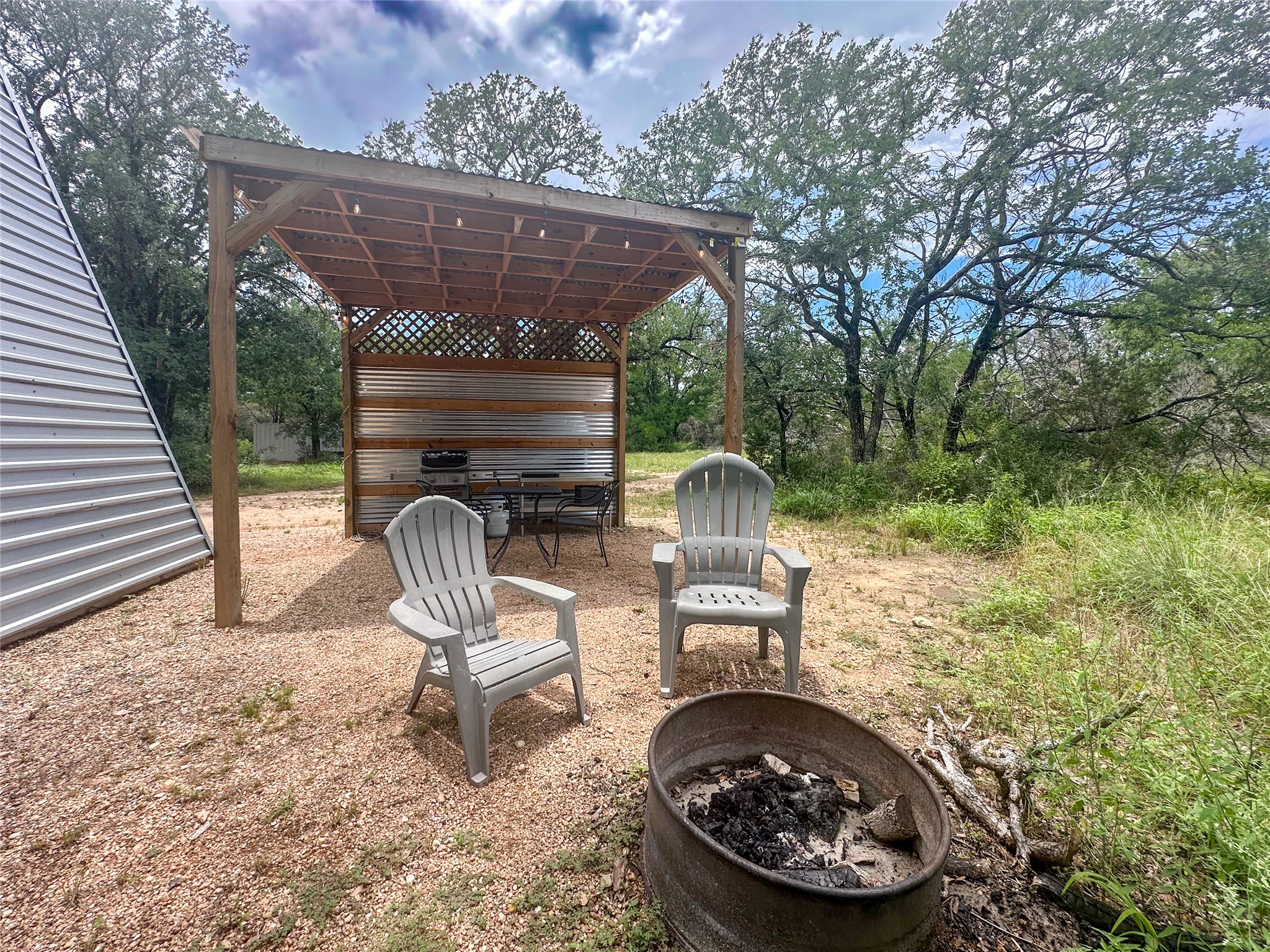 5200 Ranch To Market 1431 Marble Falls, TX 78654 - Photo 36 of 38 a view of a chair and table in the back yard of the house