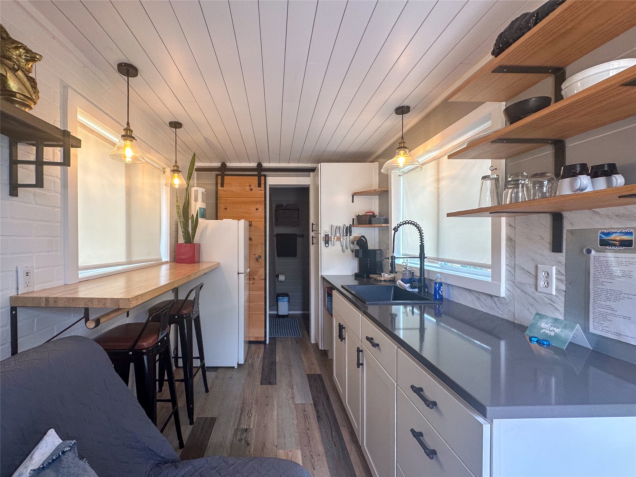 5200 Ranch To Market 1431 Marble Falls, TX 78654 - Photo 7 of 38 a kitchen with stainless steel appliances granite countertop a sink and cabinets