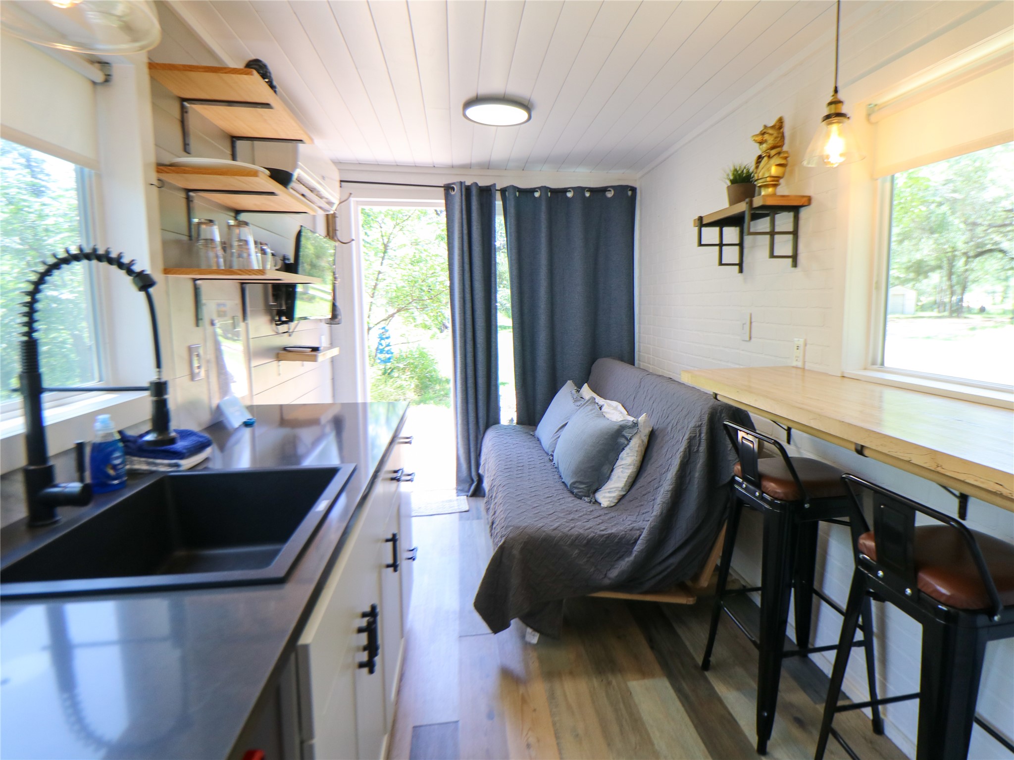 5200 Ranch To Market 1431 Marble Falls, TX 78654 - Photo 8 of 38 a kitchen with a table chairs and a sink