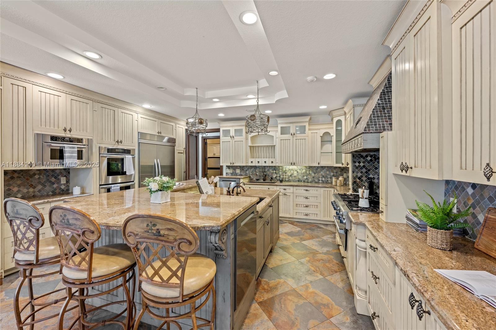 17801 Southwest 50th Street Southwest Ranches, FL 33331 - Photo 18 of 45 a very nice looking open dining room with kitchen island furniture and a chandelier