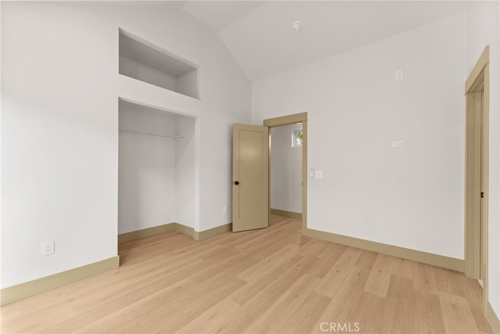 5409 Magnolia Avenue Riverside, CA 92506 - Photo 16 of 21 a view of an empty room with wooden floor