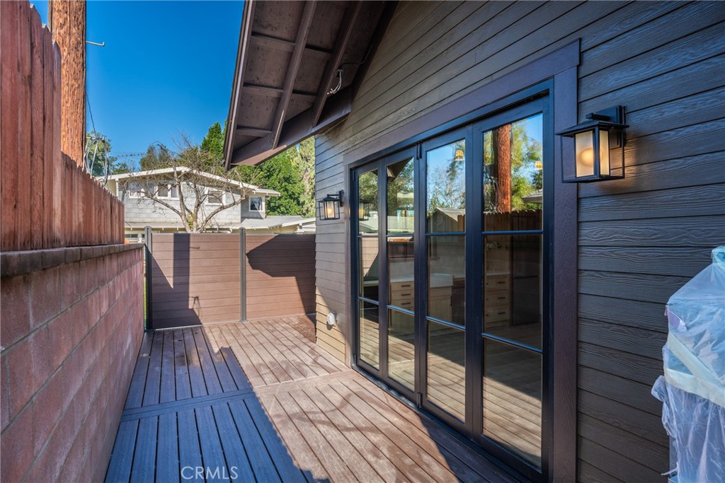 5409 Magnolia Avenue Riverside, CA 92506 - Photo 19 of 20 a view of balcony with wooden floor