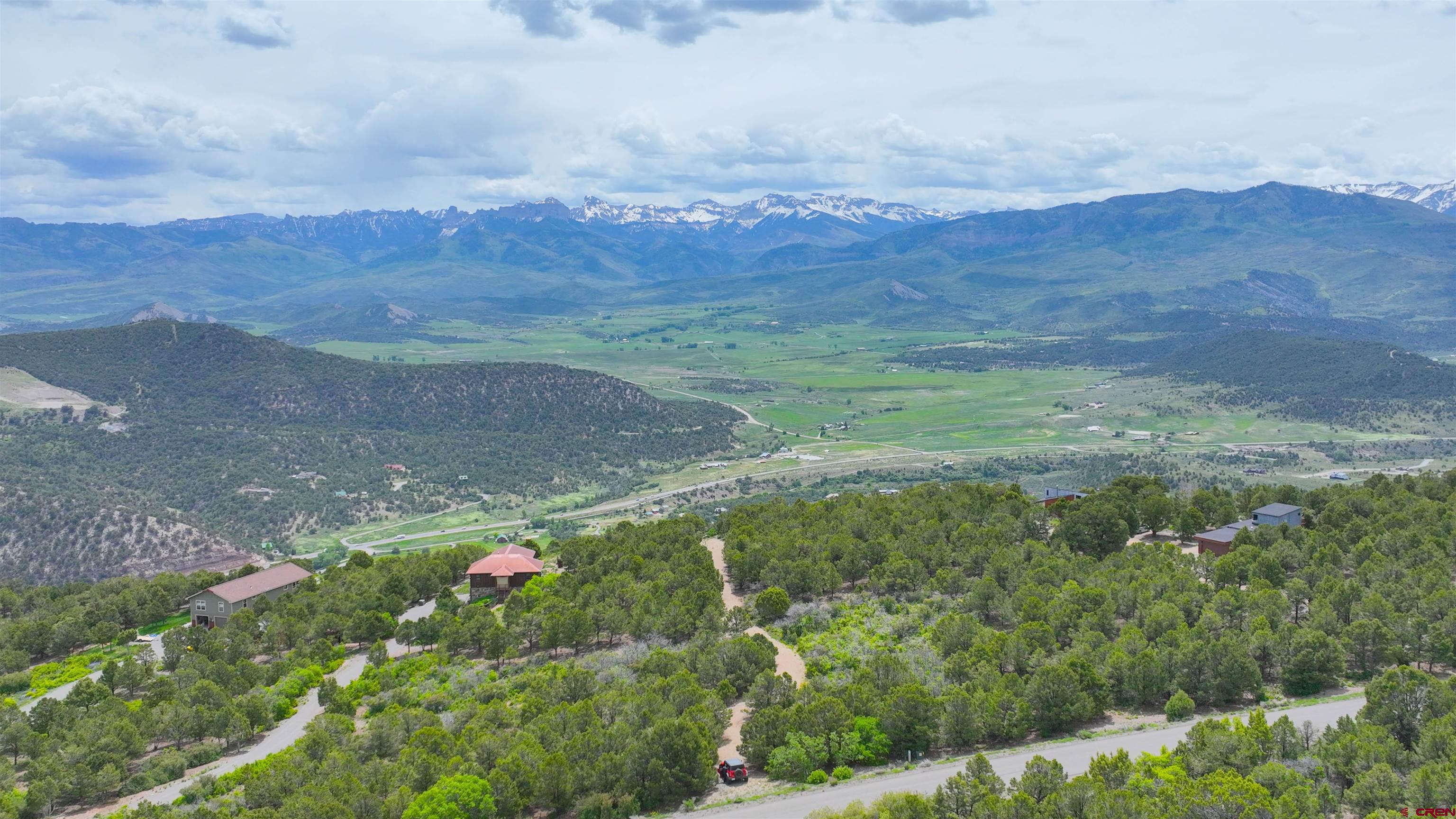 818 Pine Drive Ridgway, CO 81432 - Photo 12 of 25 a view of a lush green hillside and a houses