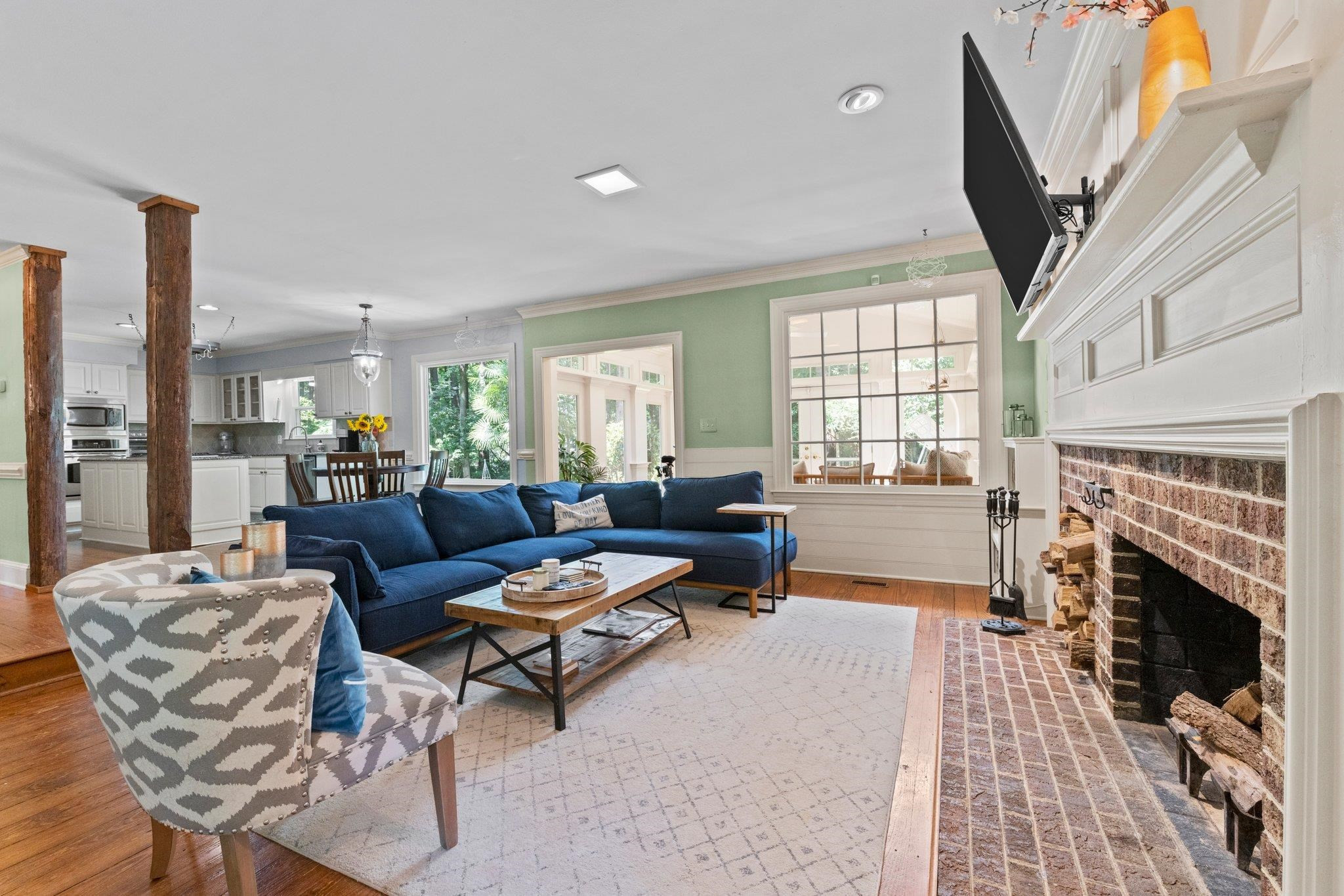 9301 Greenfield Drive Raleigh, NC 27615 - Photo 12 of 48 So much character throughout this home and beautiful wooden columns leading from the Kitchen down into the Family Room. Family Room