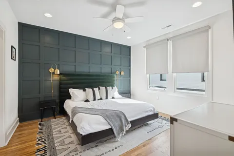 a bedroom with a bed and a table