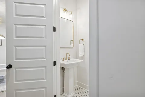a bathroom with a sink and mirror