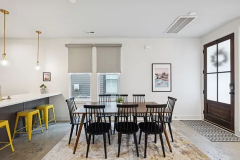 a view of a dining room with furniture