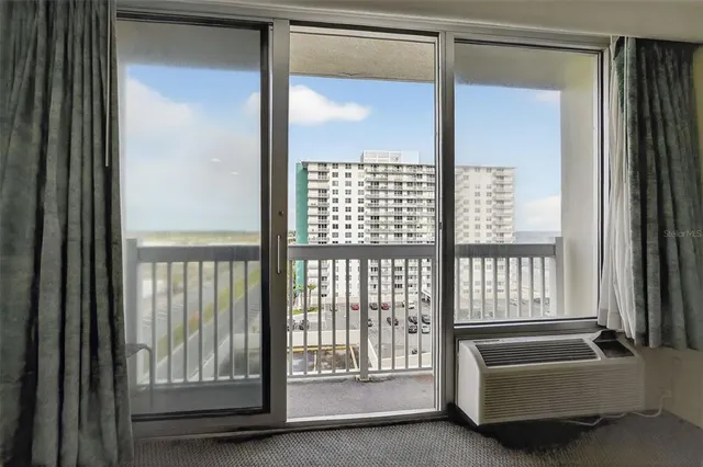 a view of an empty room with a window