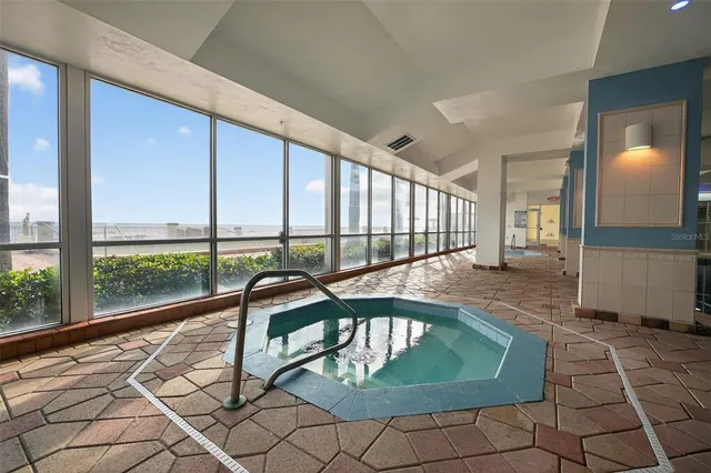 a view of a swimming pool with a lounge chairs