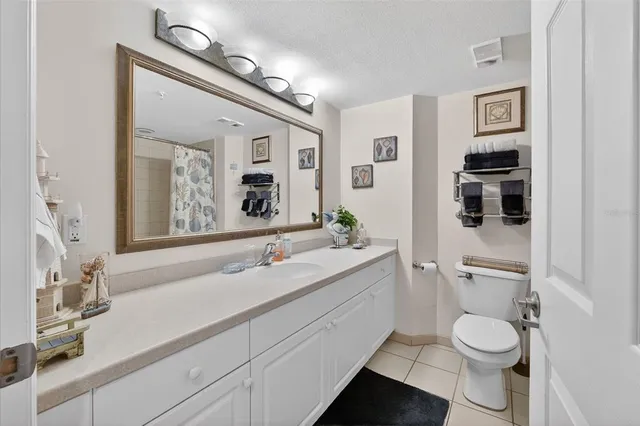 a bedroom with a bed and a lamp with window